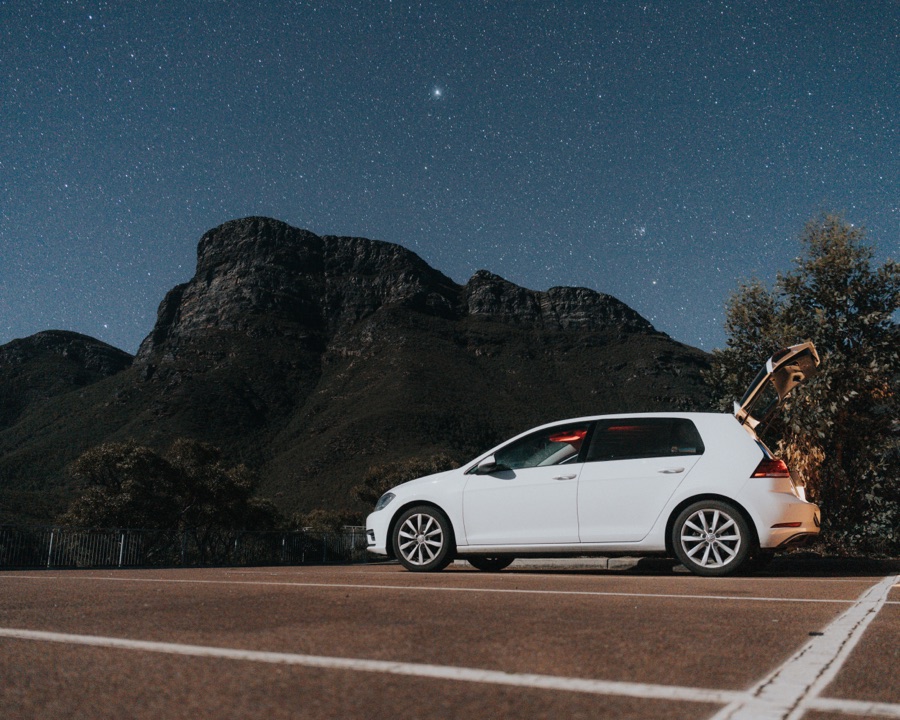Long exposure of a car beneath the night sky near Bluff Knoll